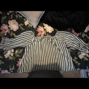 Cropped black and white off the shoulder shirt